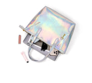 Holographic | Madison holographic zip tote shown open with everyday essentials