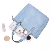 Aqua | Madison 16L aqua zip tote shown open with everyday essentials