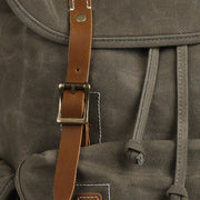Olive Green | Waxed canvas backpack leather buckle close-up