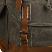 Olive Green | Olive green backpack front pocket and strap detail
