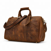 Light Brown | Beaumont vintage leather travel duffel three-quarter view showing structured body