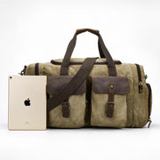 Light Brown | Light brown waxed canvas duffel shown beside a tablet for scale