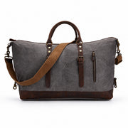 Gray | Voyager gray waxed canvas duffel rear view with leather trim