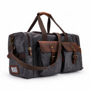 Gray | Gray waxed canvas travel duffel with leather-wrapped handles