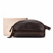 Sullivan leather travel dopp kit shown beside a tablet for size reference