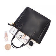 Black | Madison black zip tote shown open with everyday essentials
