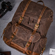 Brown waxed canvas backpack top angled view