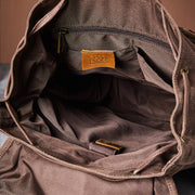Brown backpack polyester interior and laptop sleeve
