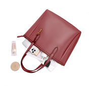 Red | Madison red zip tote shown open with everyday essentials
