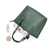Green | Madison dark green zip tote shown open with everyday essentials