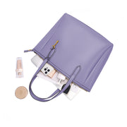 Purple | Madison purple zip tote shown open with everyday essentials