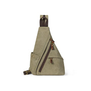Brown | Atlas brown convertible sling bag angled view with zippered pockets