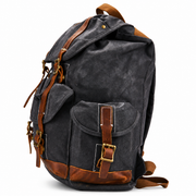 Gunmetal | Gunmetal leather-trimmed rucksack side profile
